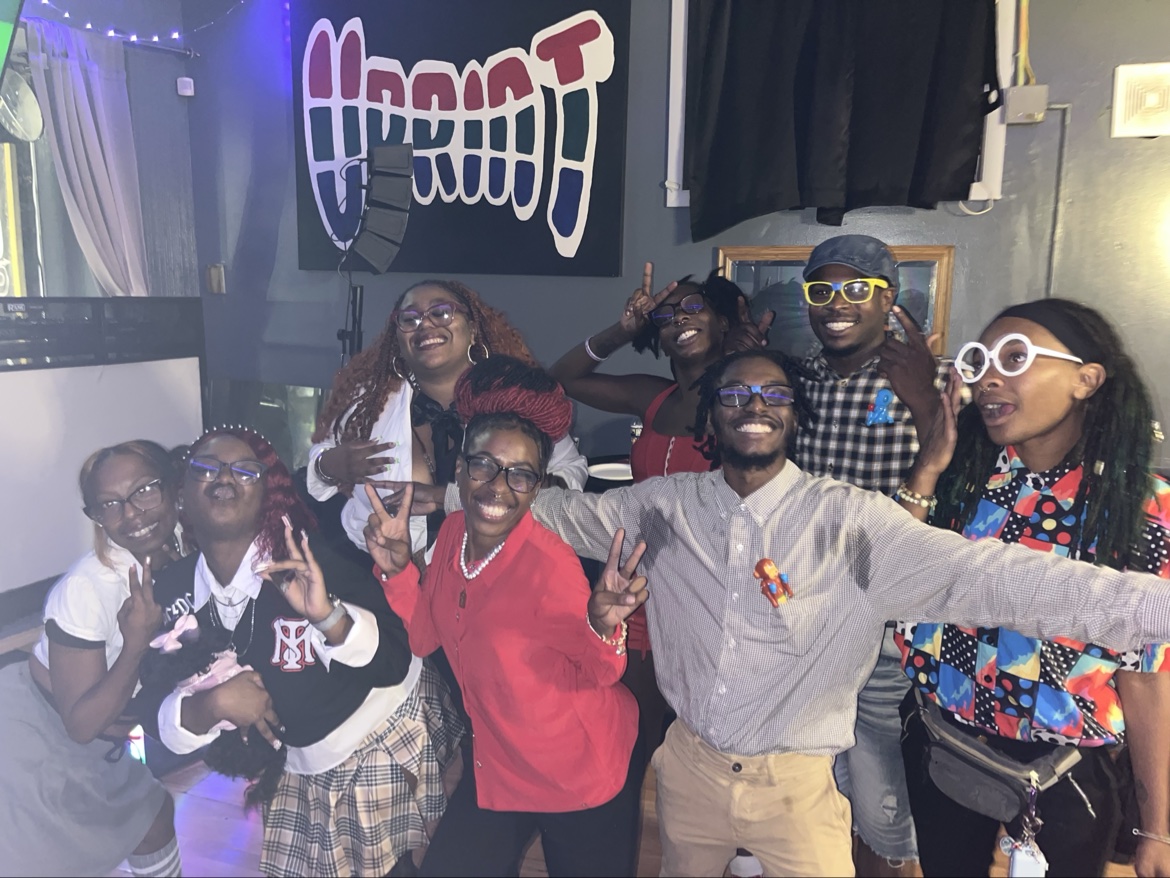 A lively group posing together inside
