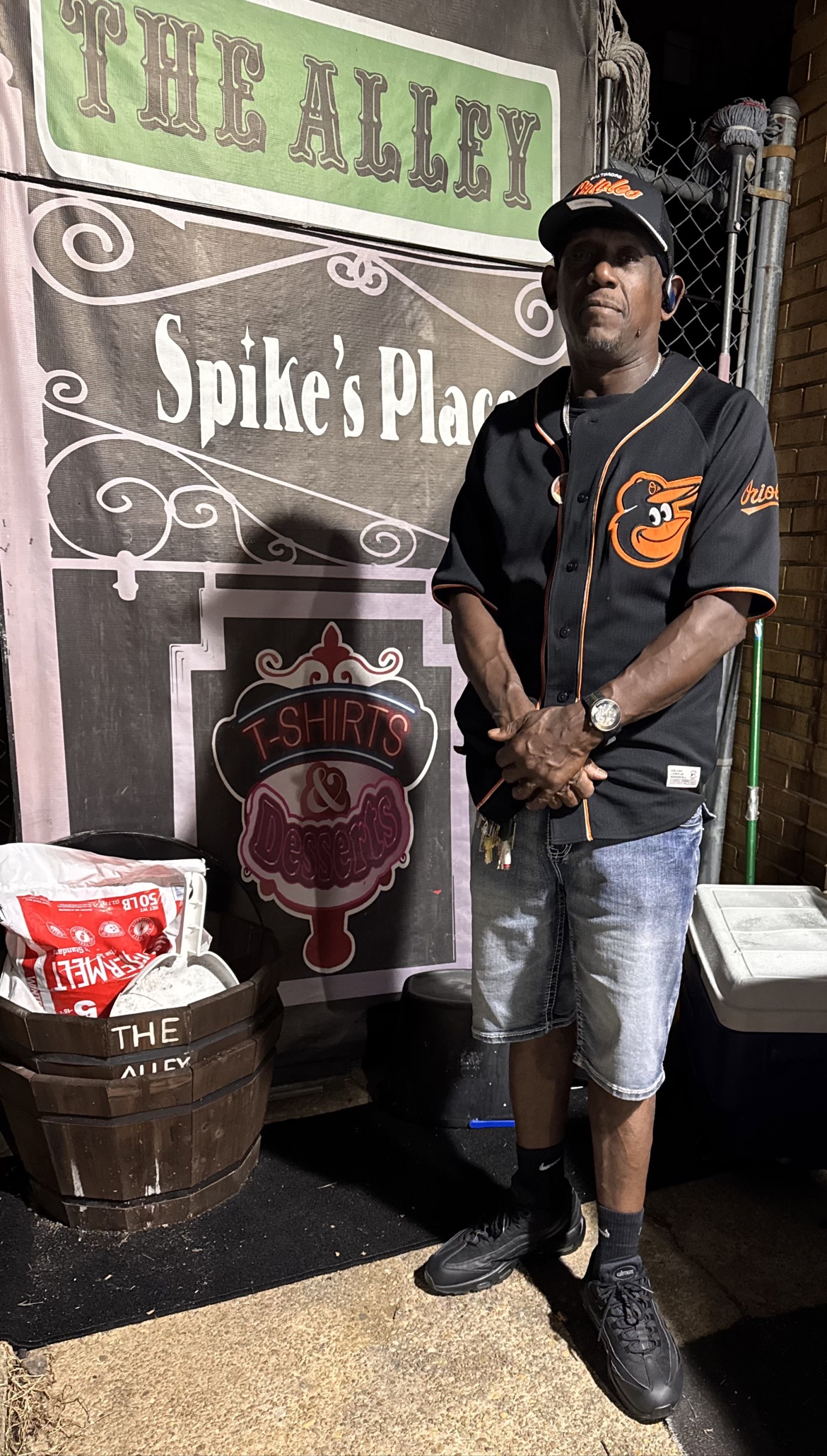 Spike outside at night in an Orioles jersey
